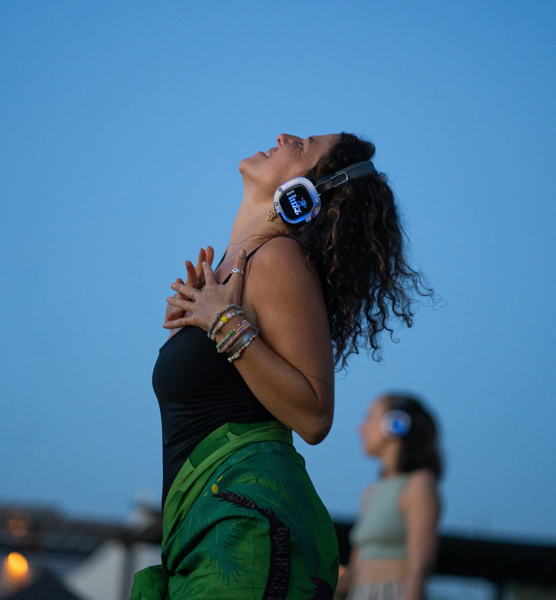 Silent disco rental Bali - premium wireless headphones for hire at sunset beach party